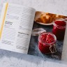 Cold Canning book open to page that displays recipes on the left and pickled food on the right